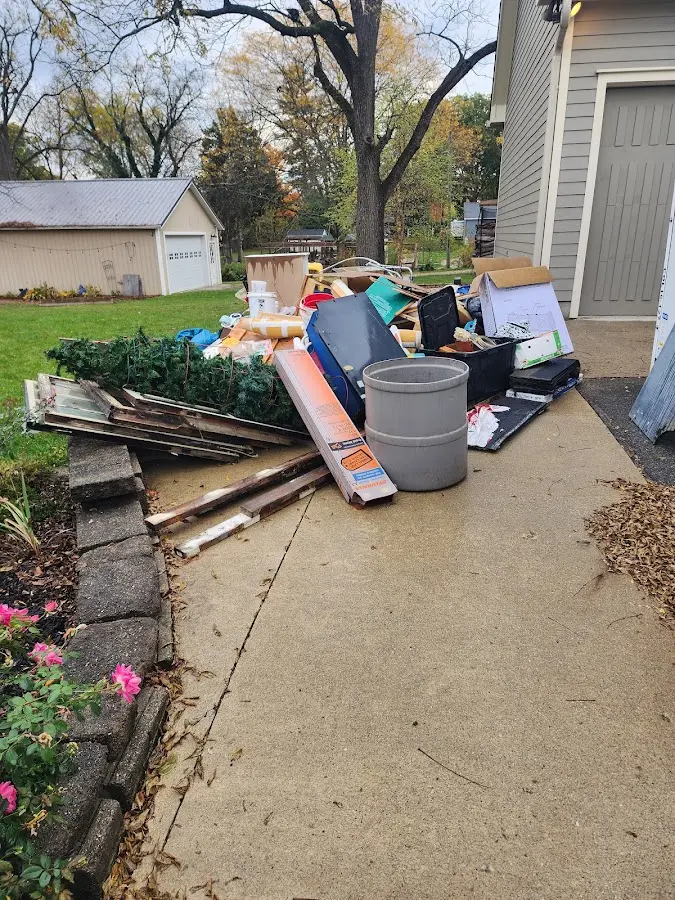 Dumpster being loaded with debris for 30 Yard Dumpster Rental in Van Wert
